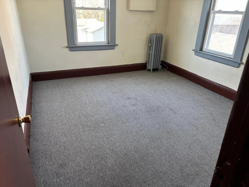 The same North NJ bedroom, now completely empty and professionally cleared of the mattress, bed frame, and all furniture by Junk Doctors NJ.