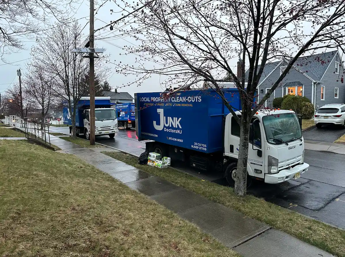 JunkDoctors NJ fleet arriving for an emergency flood cleanout and water damage debris removal in a North Jersey neighborhood.
