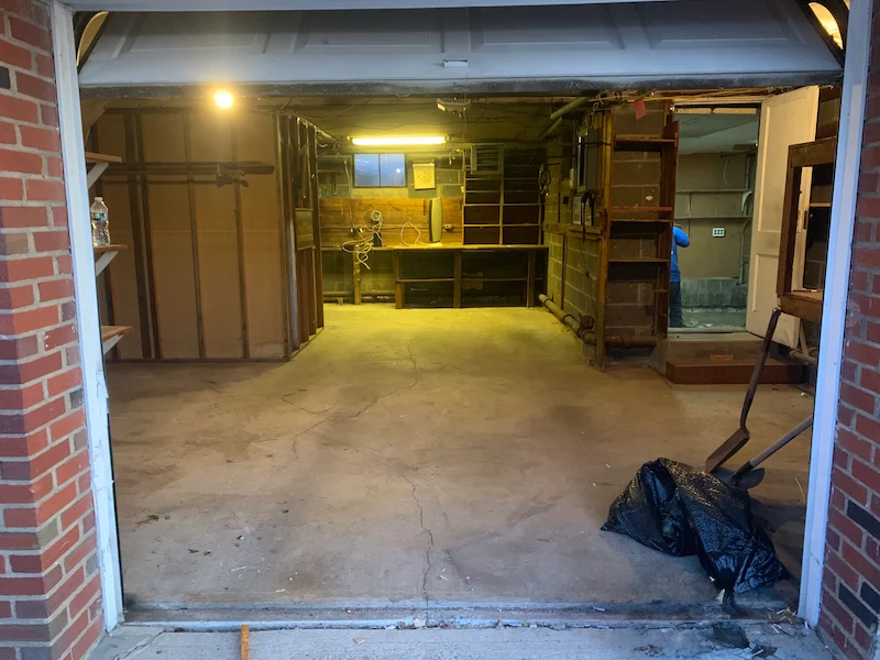 The interior of a residential garage completely cleared of debris and swept clean by our JunkDoctors hauling team.
