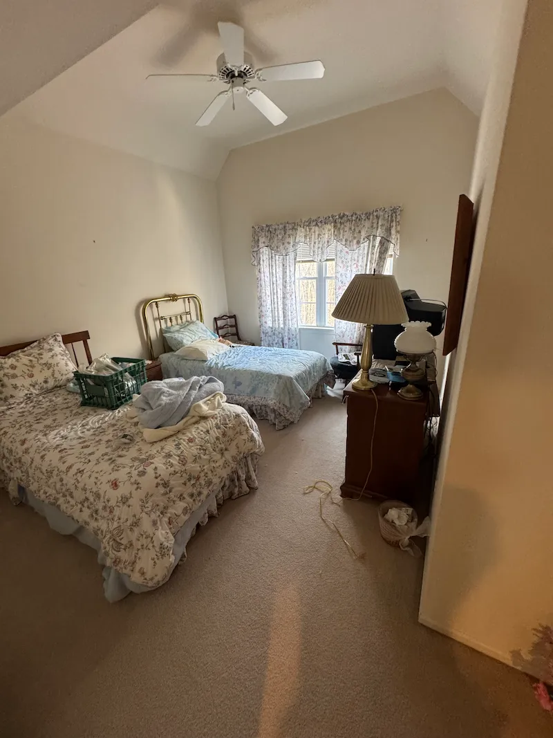 Before photo showing a fully furnished bedroom ready for JunkDoctors in-home mattress, boxspring, and frame removal in New Jersey.