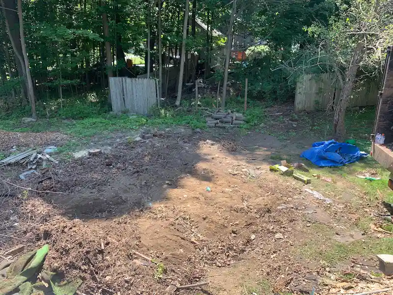 After photo: A clean, clear backyard space in New Jersey where a dilapidated wooden shed was completely demolished and hauled away by the Junk Doctors crew.