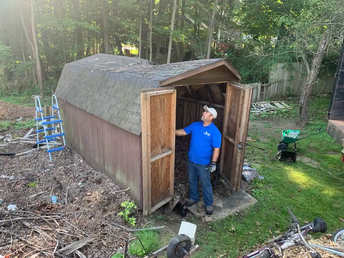JunkDoctors crew performing a residential shed cleanout and junk removal in New Jersey.