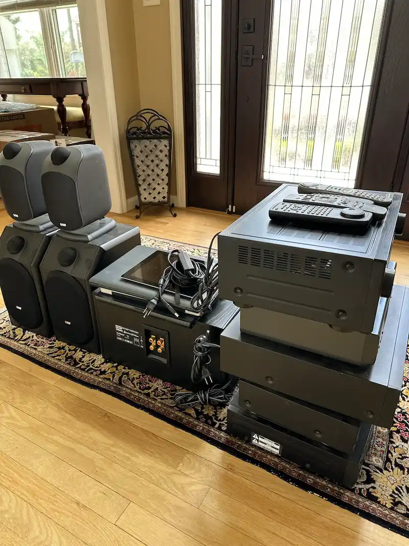 Home audio equipment, including speakers and receivers, staged for professional electronics recycling and removal in North NJ by JunkDoctors NJ.